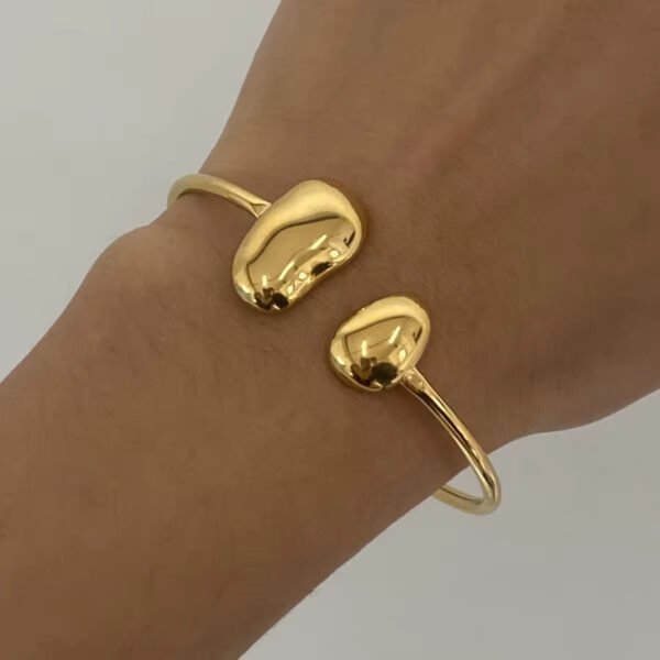 Brazalete Droplets Acero Baño Oro